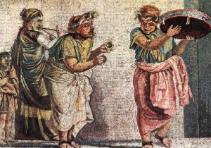 Trío de músicos tocando un aulós, cymbala y tympanum (mosaico de Pompeya).